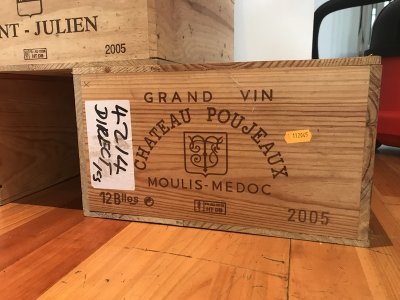 Lot 4:  Chateau Poujeaux 2005 (OWC of 12) Moulis. Recently removed from a country house cellar. Provenance: Berry Bros. and Rudd. Perfect appearance. When  to drink: 2012-2020 JR.