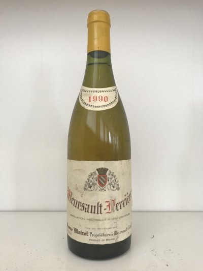 Lot 25:  Pierre Matrot Meursault-Perrieres 1990 (1 bottle) Provenance: Recently removed from a damp French country house cellar.  Level: 1cm, damp soiled label. Excellent colour.