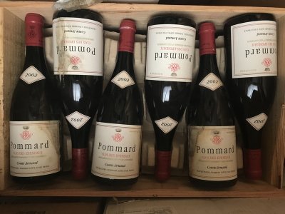 Lot 37:  Comte Armand Pommard 1er cru Clos des Epeneaux 2002 (12 bottles) Recently removed from a country house cellar. Provenance: Wine Society.  Excellent levels. Four damp soiled labels.