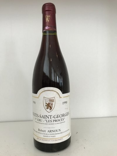 Lot 47:  Robert Arnoux Nuits-St-Georges 1er  Cru Les Procès 1990 (8 bottles in OC of 12) Provenance: Recently removed from a damp French country house cellar. 