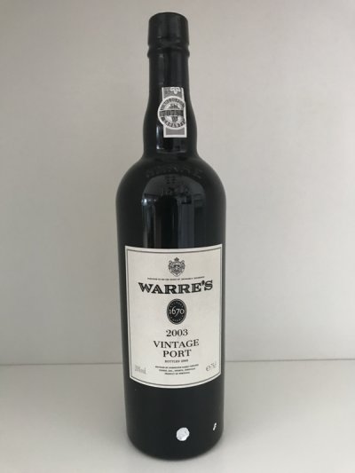 Lot 74:  Warres Vintage Port 2003 (3 bottles) Recently removed from a London cellar. Provenance: Berry Bros. and Rudd. Excellent appearance and levels.